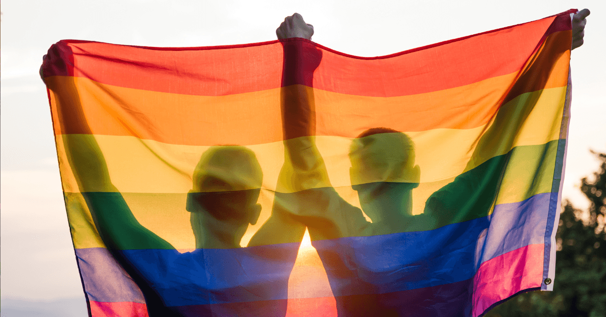 Gay couple Holding Pride Flag