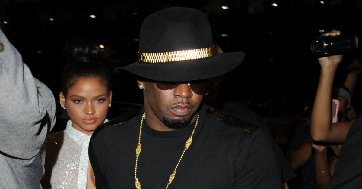 P.Diddy and girlfriend Cassie arrive at McGregor Vs Mayweather holding a bottle of champagne.