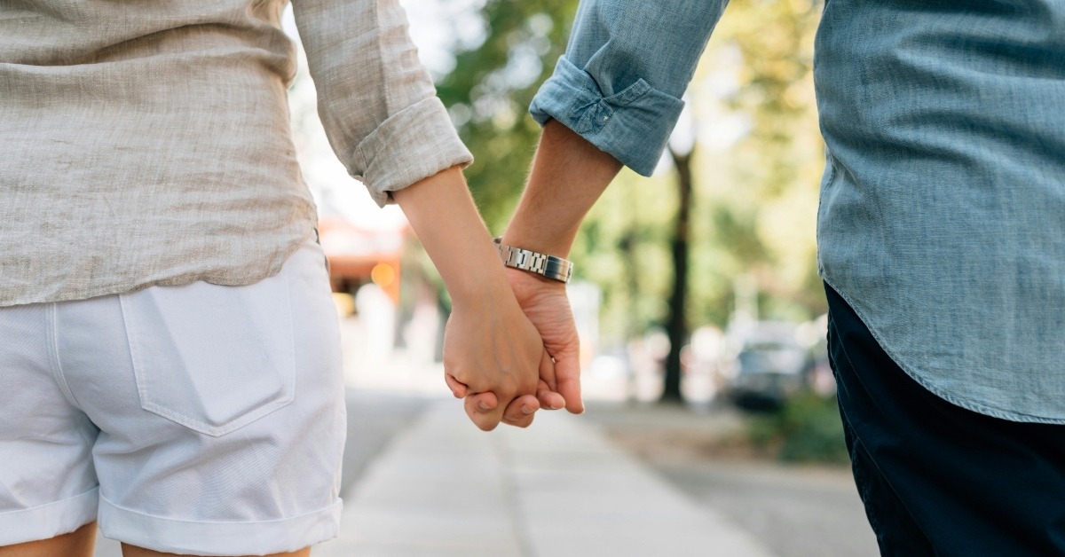 Couple holding hands