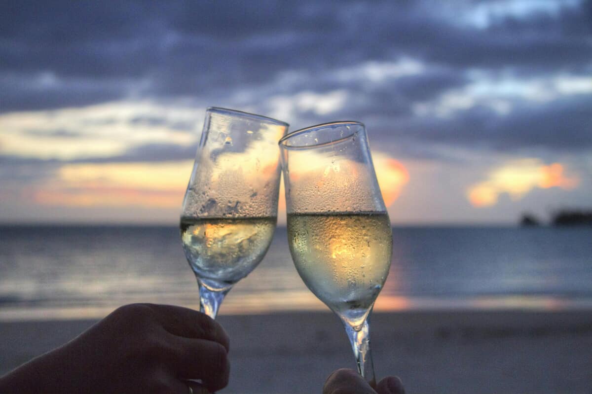 Pexels — Clinking glasses on the beach
