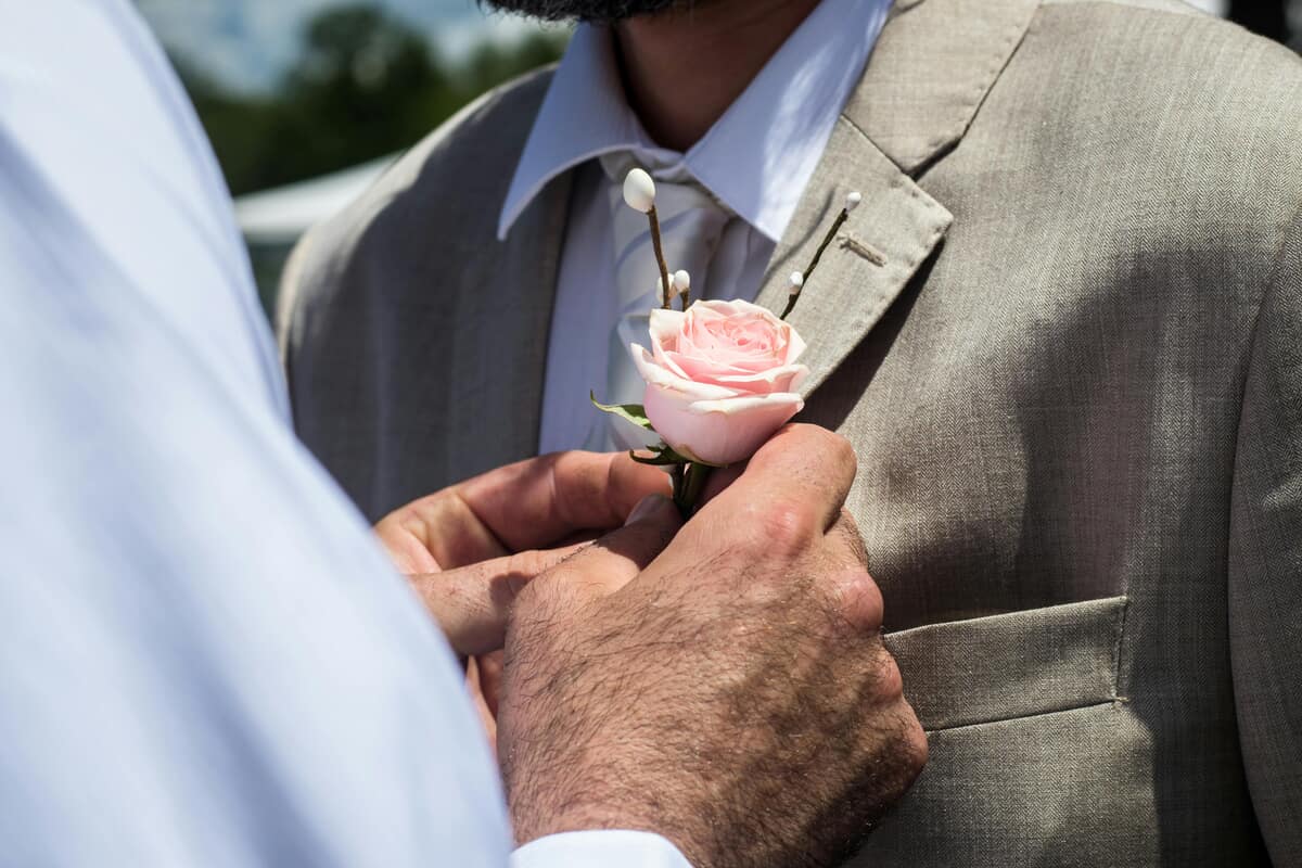 Grooms getting married. Photo by Trinity Kubassek from Pexels: https://www.pexels.com/photo/pink-rose-572613/