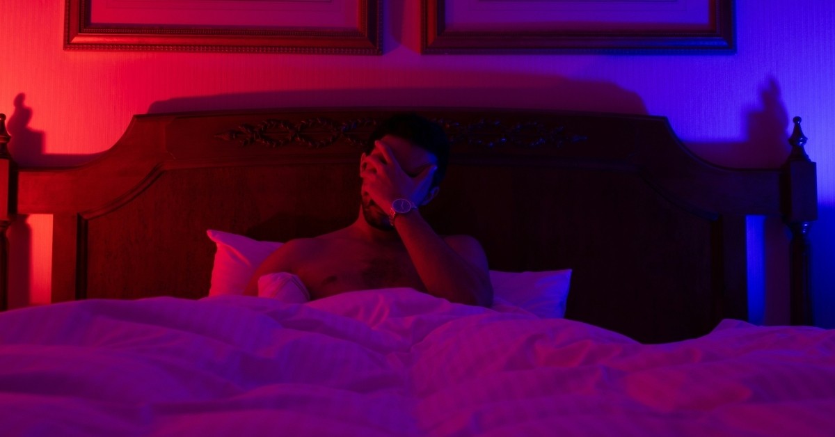 A man laying in bed
