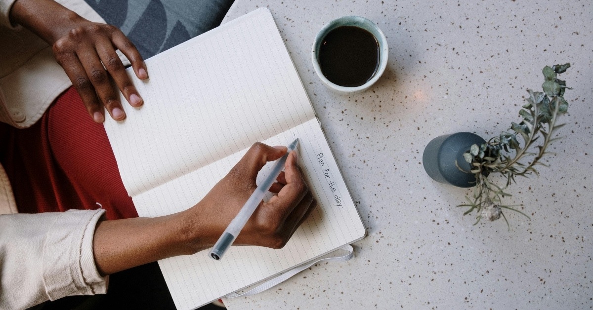 woman writing in journal