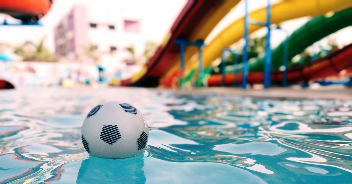 soccer ball floating in water at beach resort