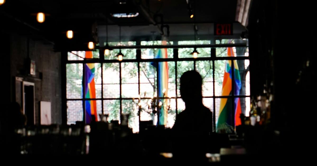 Photograph of gay bar with flags outside