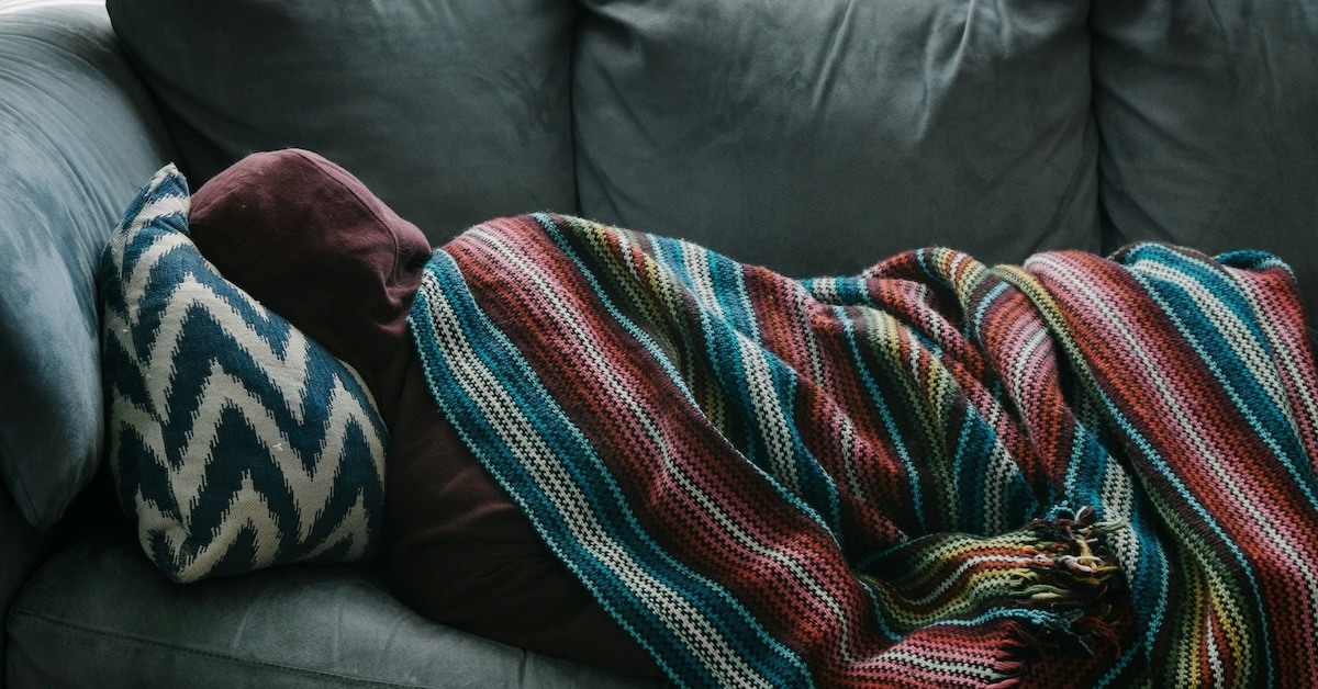 Person laying on couch. 