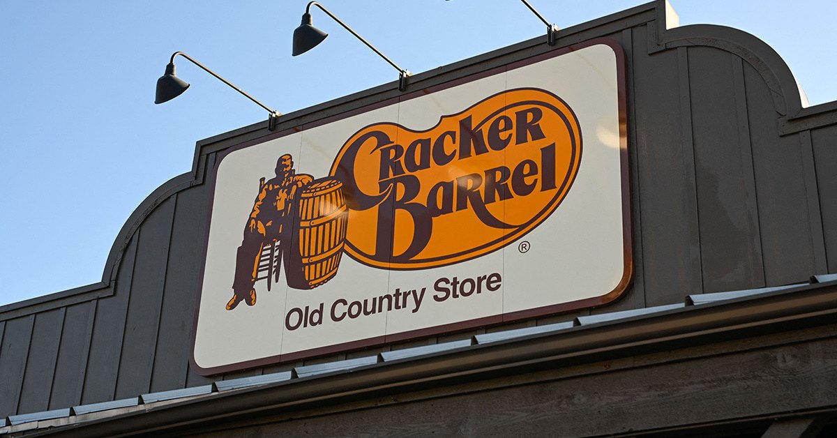 Storefront sign that reads "Cracker Barrel Old Country Store" featuring the company logo