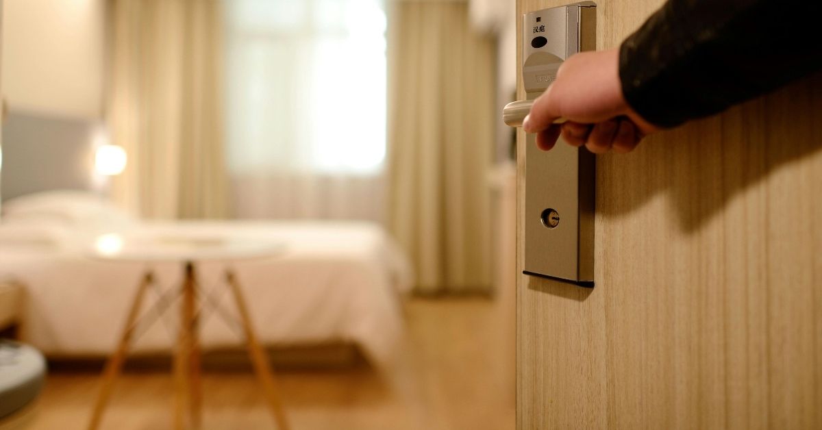 door open with blurry hotel room view