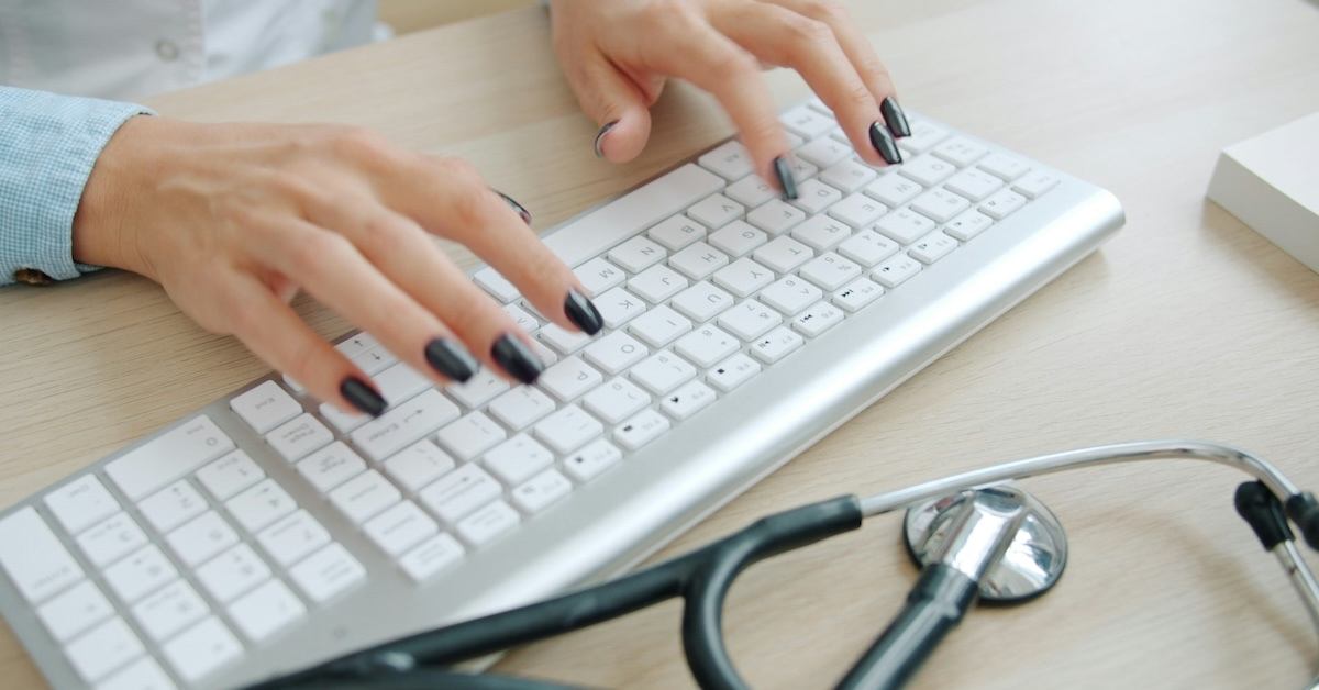 A person typing on a computer.