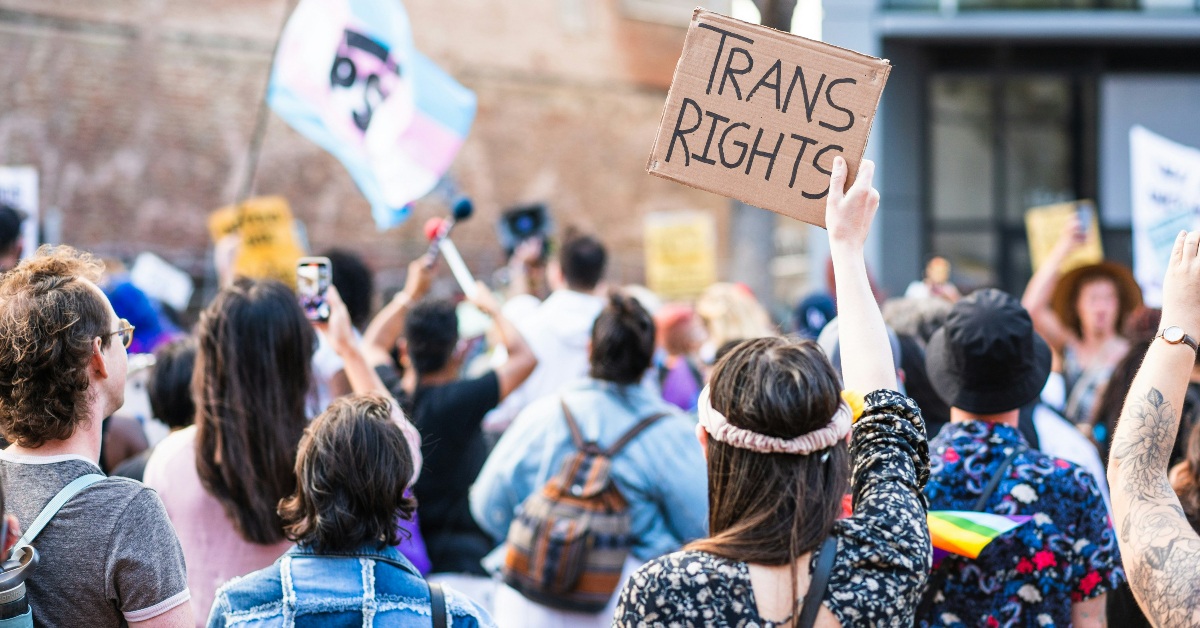 Protestors rise signs during protest