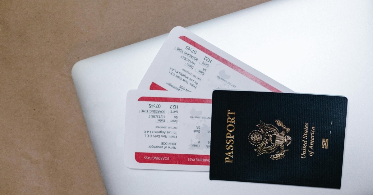 US passport on top of a laptop