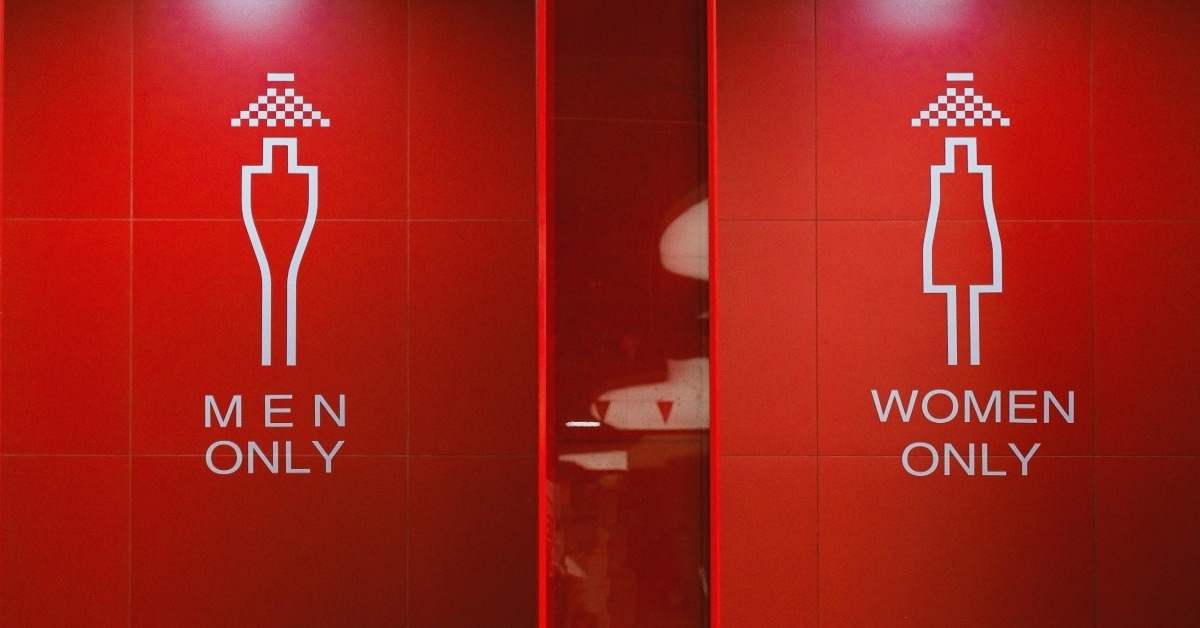 Red public restrooms with "men only" and "women only"