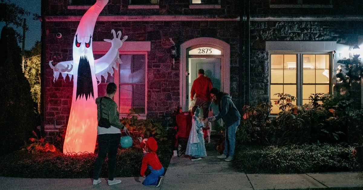 Trick or treaters visit house on Halloween