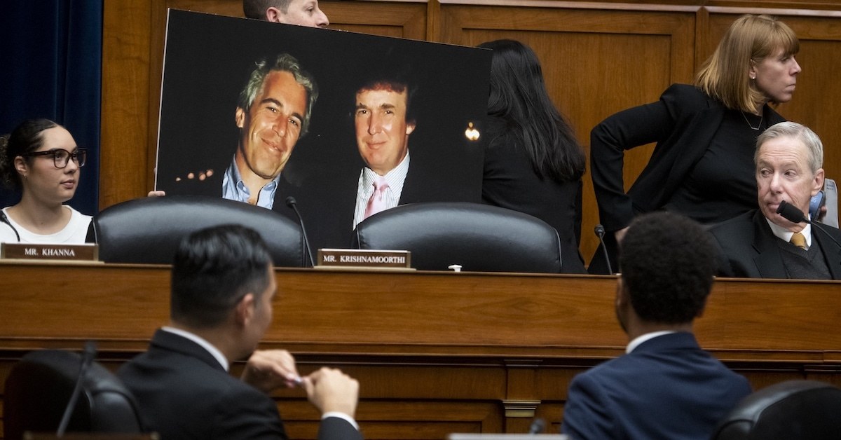 A House Committee hearing featuring a picture of Epstein and Trump.