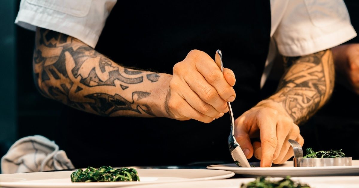 A chef plating a dish.
