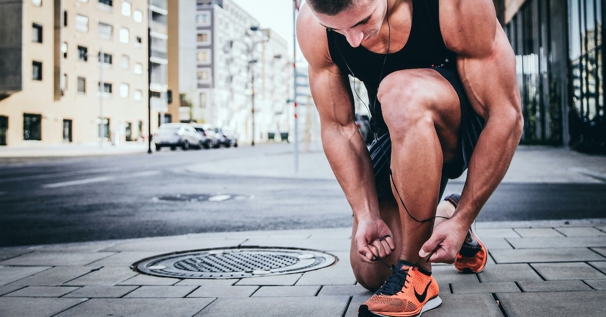 Person tying their shoe.