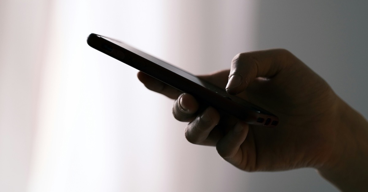 Someone holding a phone.