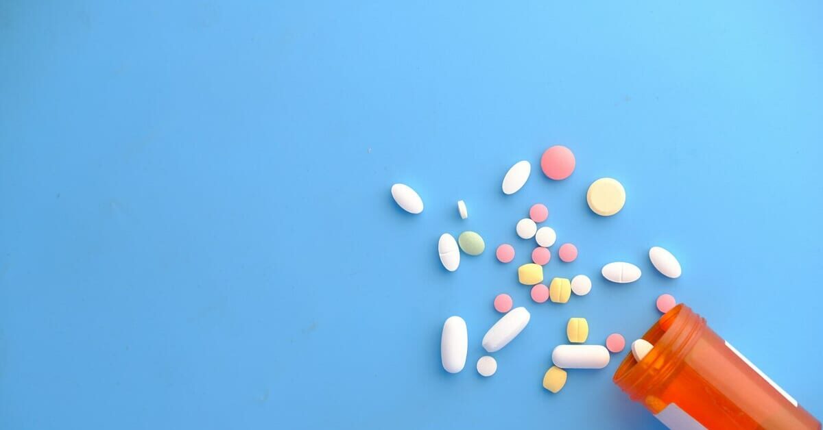 orange and white medication pill